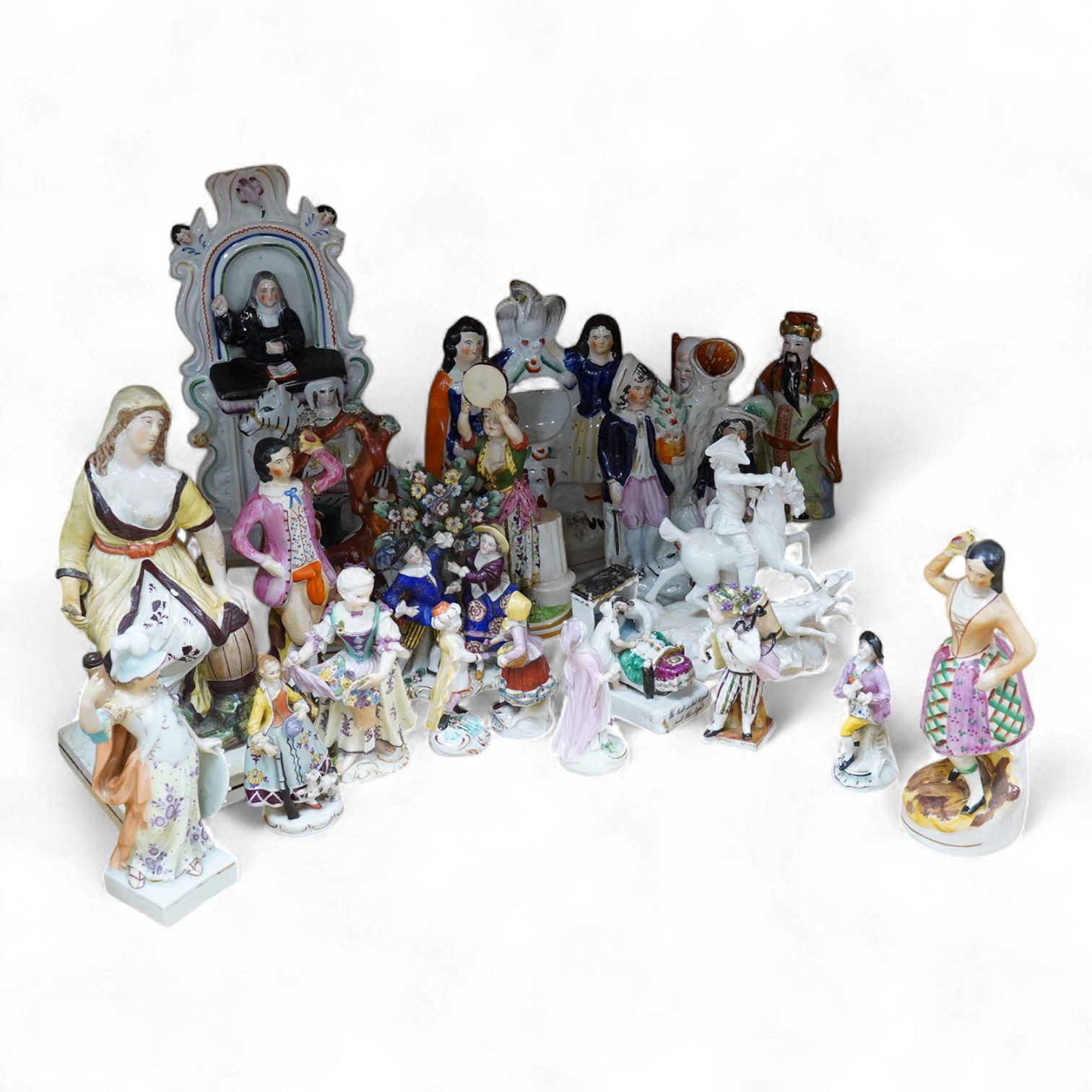 A collection of 19th century porcelain and ceramic figures, mostly Staffordshire, largest 28cm high